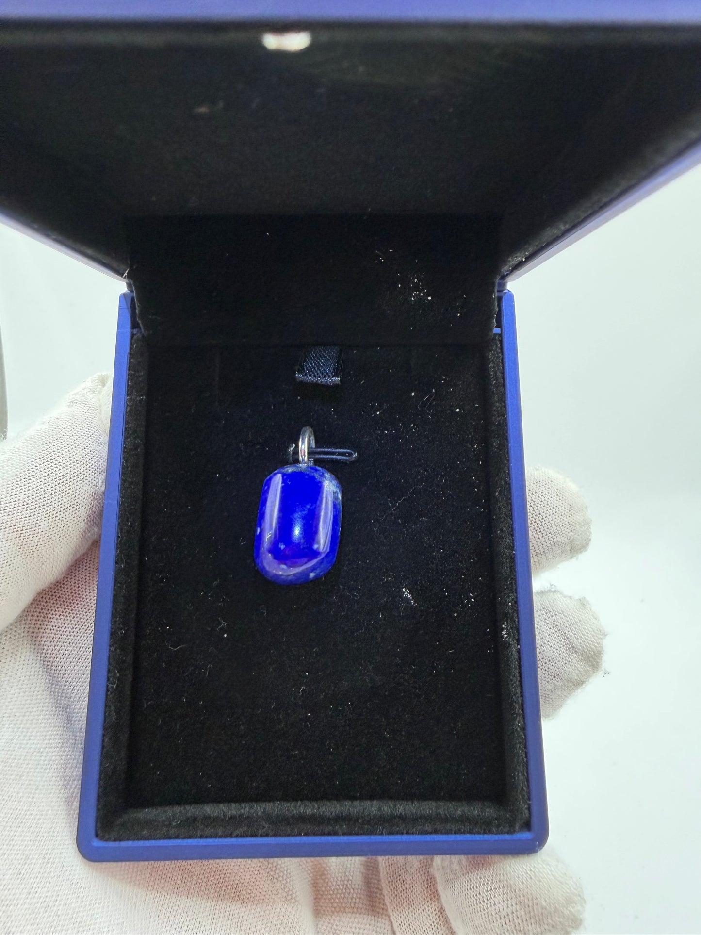 Close-up of 34ct Lapis Lazuli pendant showing rich blue color and natural pyrite flecks — Jewelry and Gems by Chandler