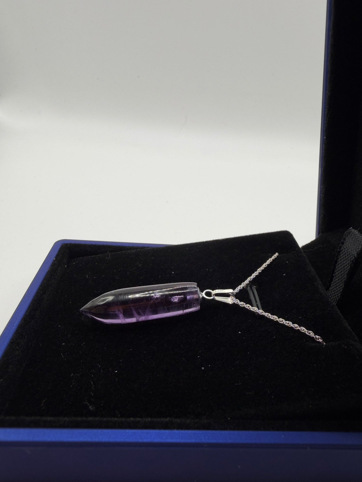Natural untreated Rwandan amethyst stone set in sterling silver pendant with chain from Maine