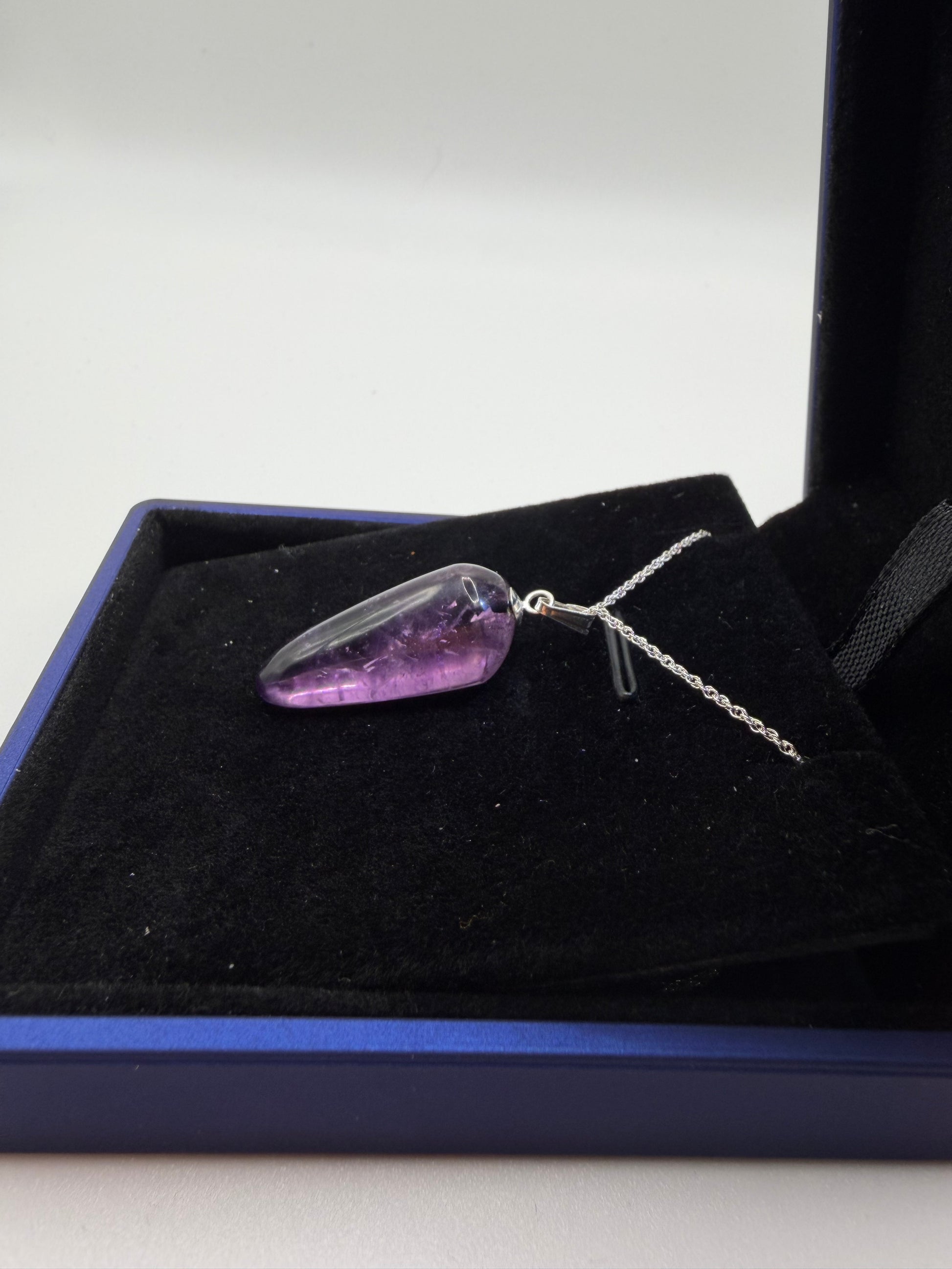 Natural untreated Rwandan amethyst stone set in sterling silver pendant with chain from Maine