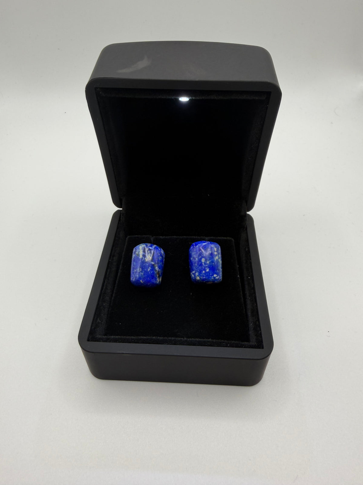 Front view of matched denim lapis lazuli stud earrings in black gift box — 26ct natural gemstone titanium posts