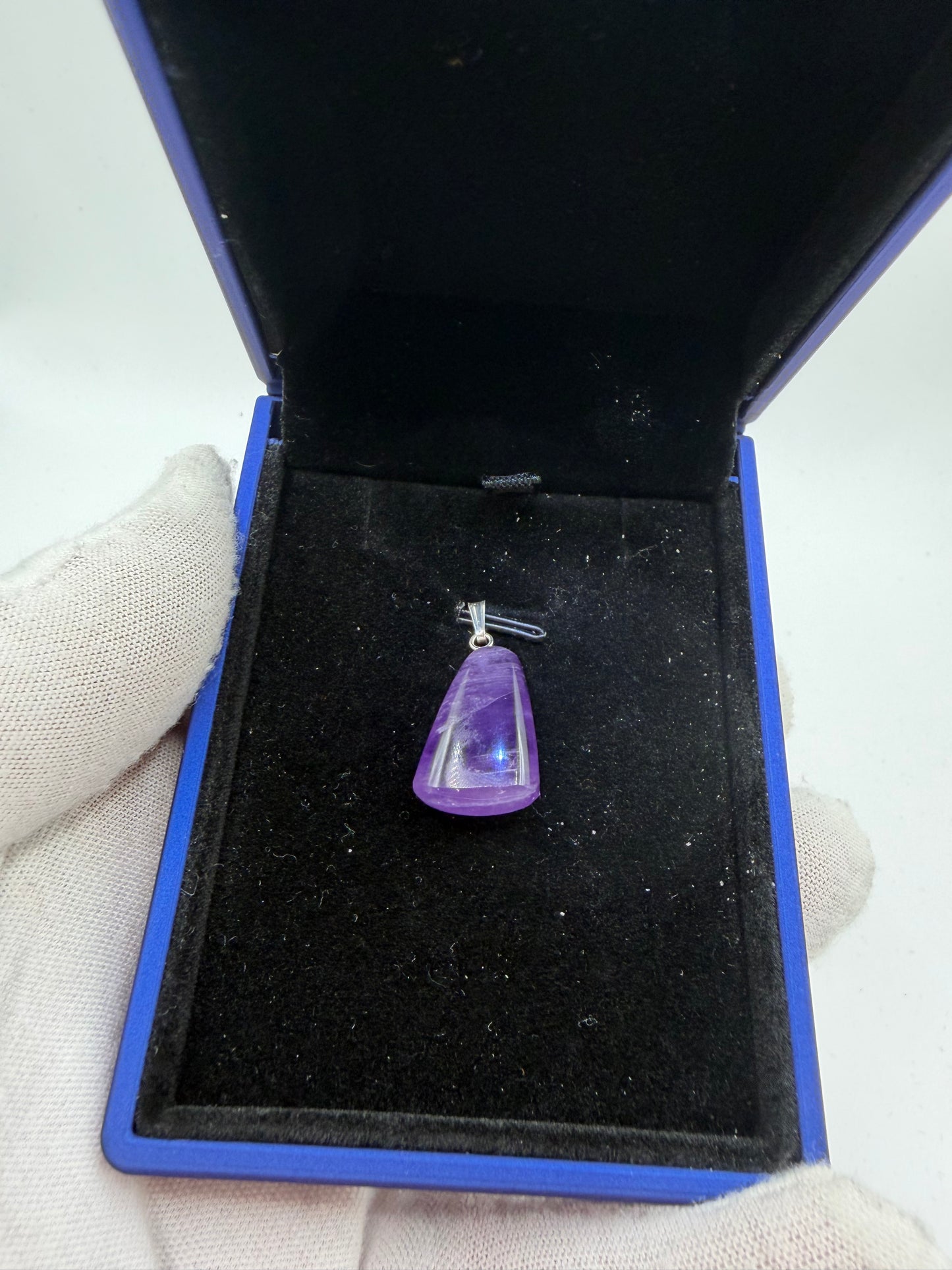 21ct Rwandan amethyst pendant close-up showing natural untreated violet color and clarity
