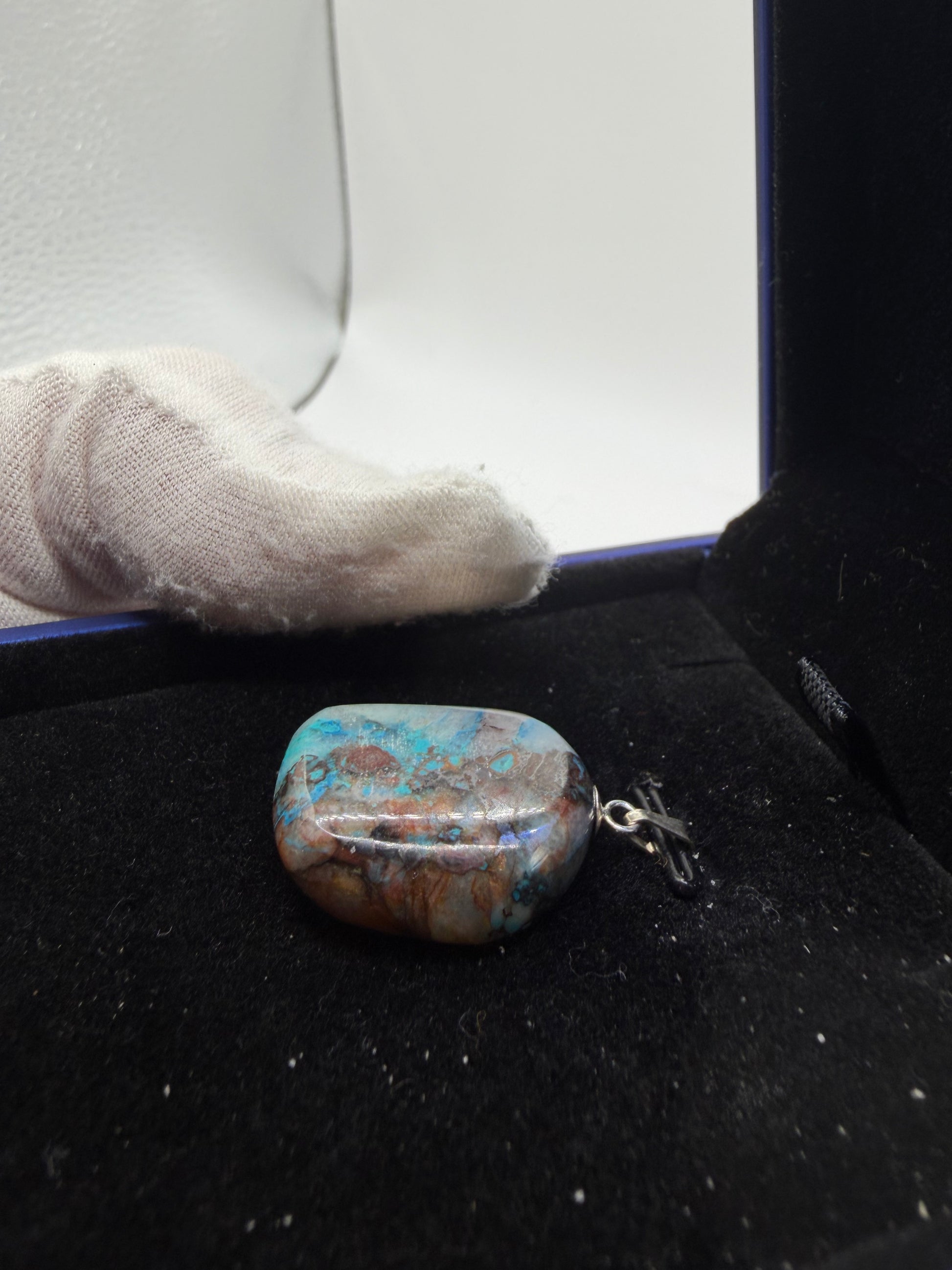 33ct Quantum Quattro pendant detail — unique swirling blue-green freeform gemstone with drilled bail, made in Maine USA