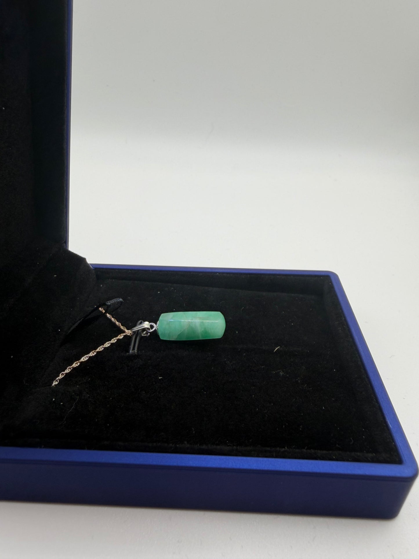 Sterling silver bail and 18 inch 1mm rope chain on 8ct Colombian emerald pendant handcrafted in Maine