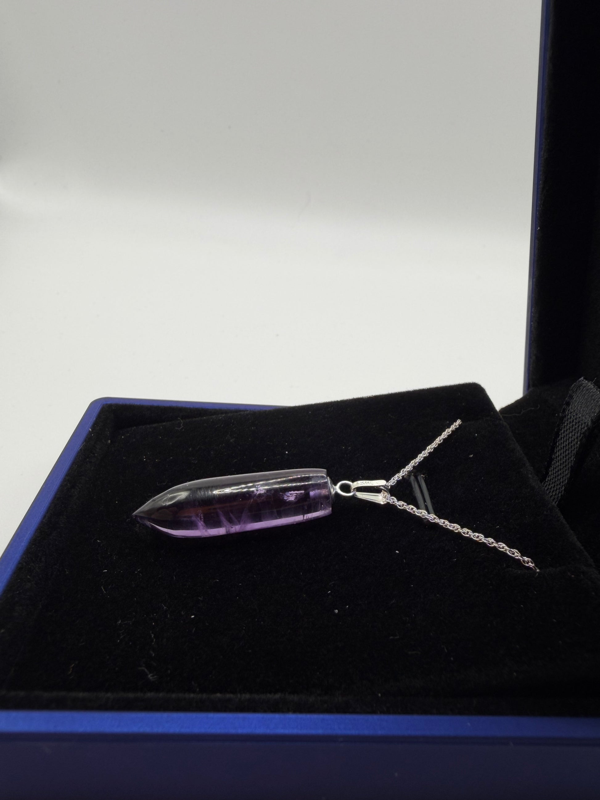 Natural untreated Rwandan amethyst stone set in sterling silver pendant with chain from Maine