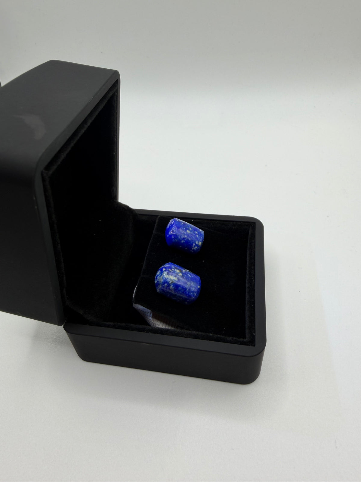 Front view of matched denim lapis lazuli stud earrings in black gift box — 26ct natural gemstone titanium posts