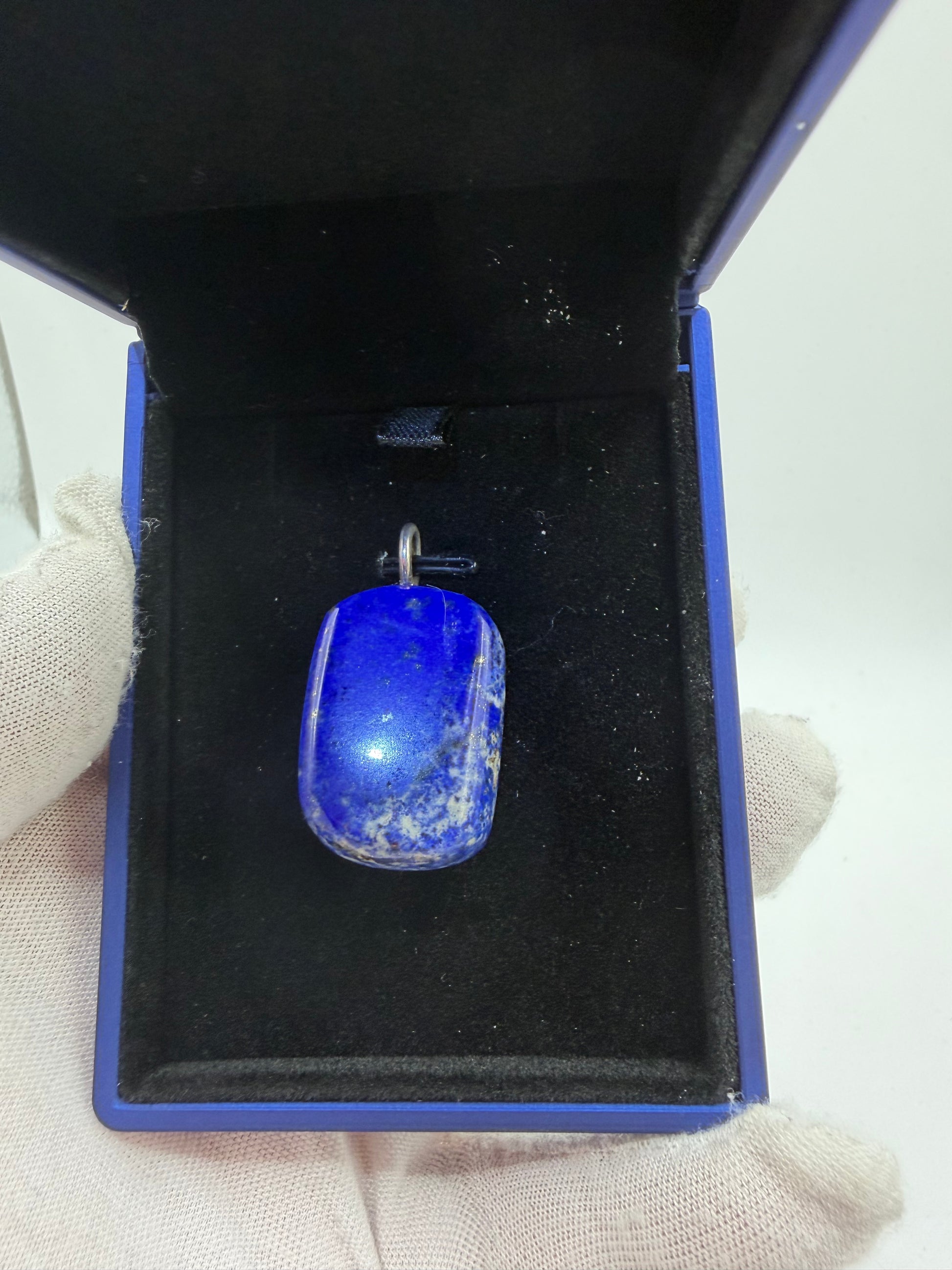 75ct lapis lazuli cabochon pendant with sterling silver bail displayed in blue jewelry box