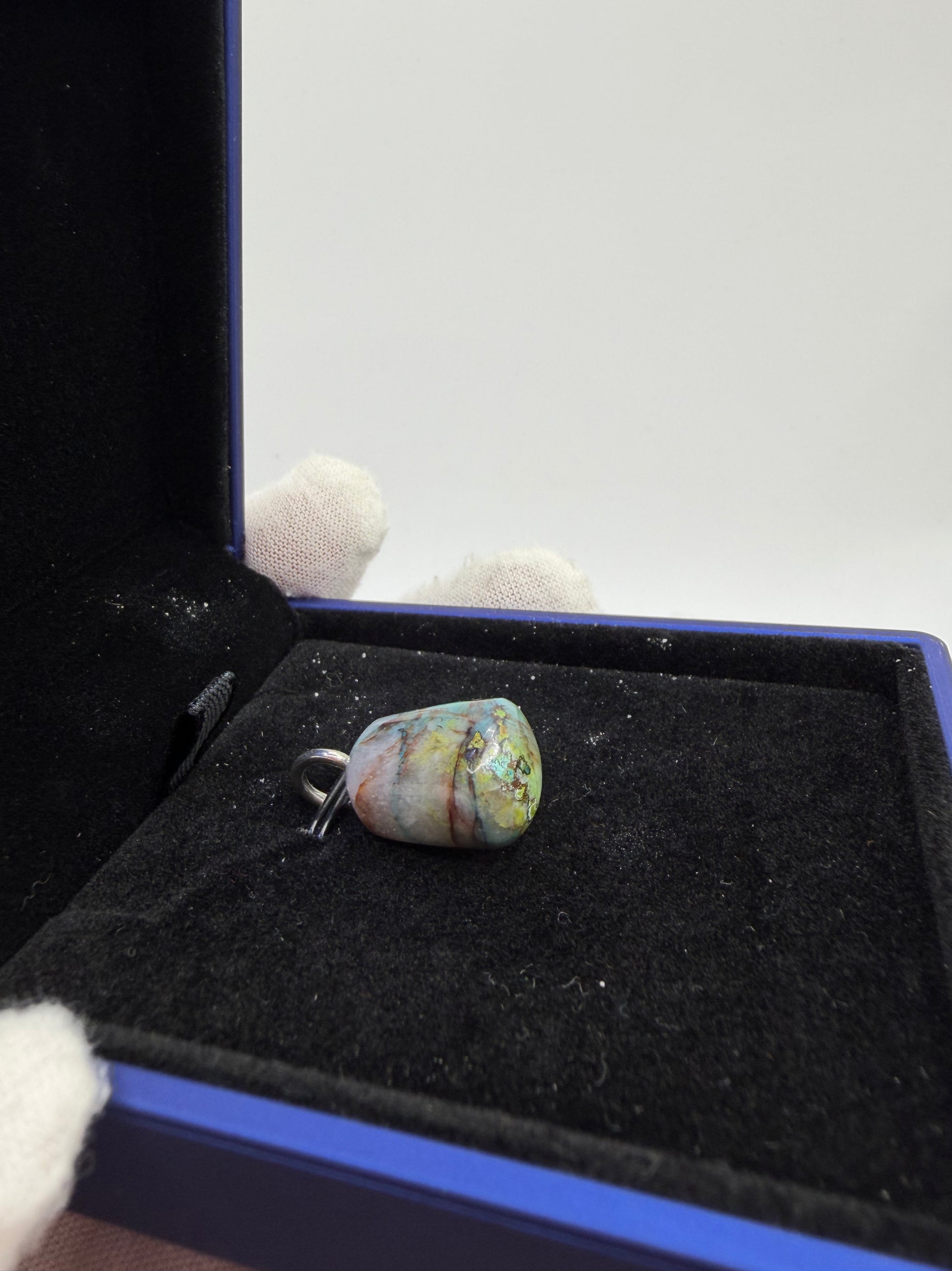 Side view of 26-carat Quantum Quattro pendant with precision-drilled sterling silver bail