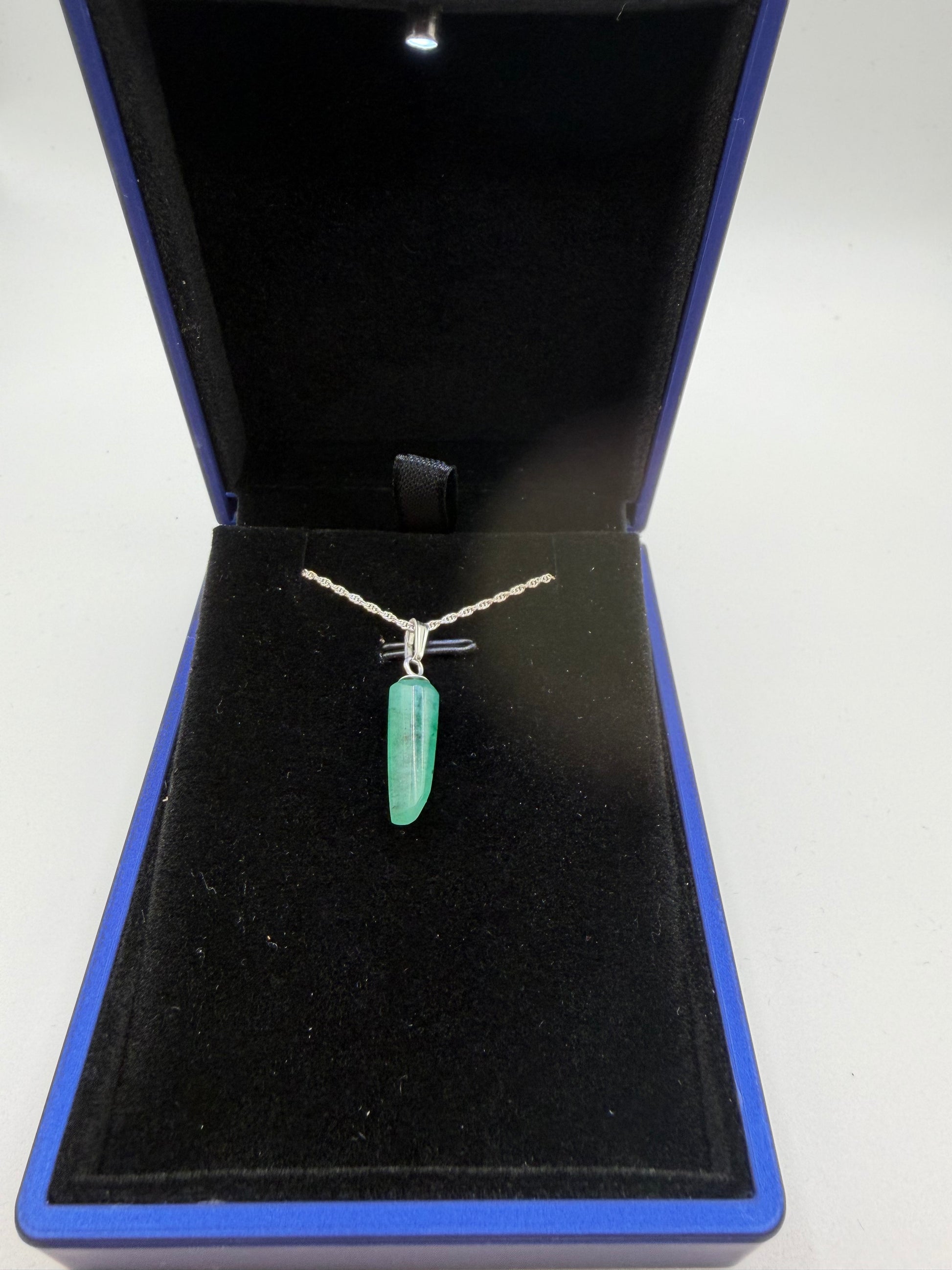 Close-up of 4.7ct natural Colombian emerald cabochon showing rich green color