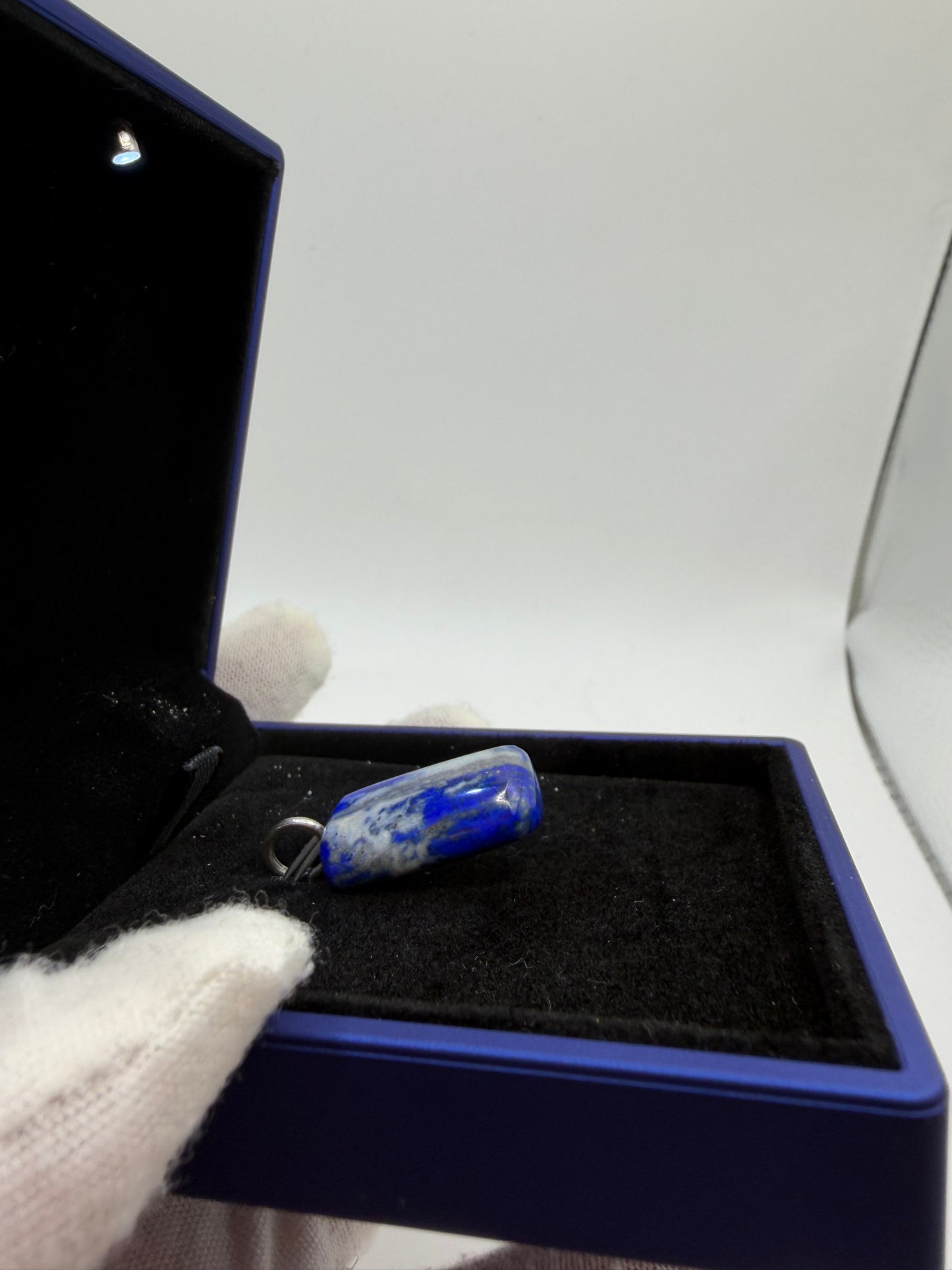 30ct Lapis Lazuli pendant flat lay — natural unenhanced gemstone with sterling silver bail, handcrafted in Maine