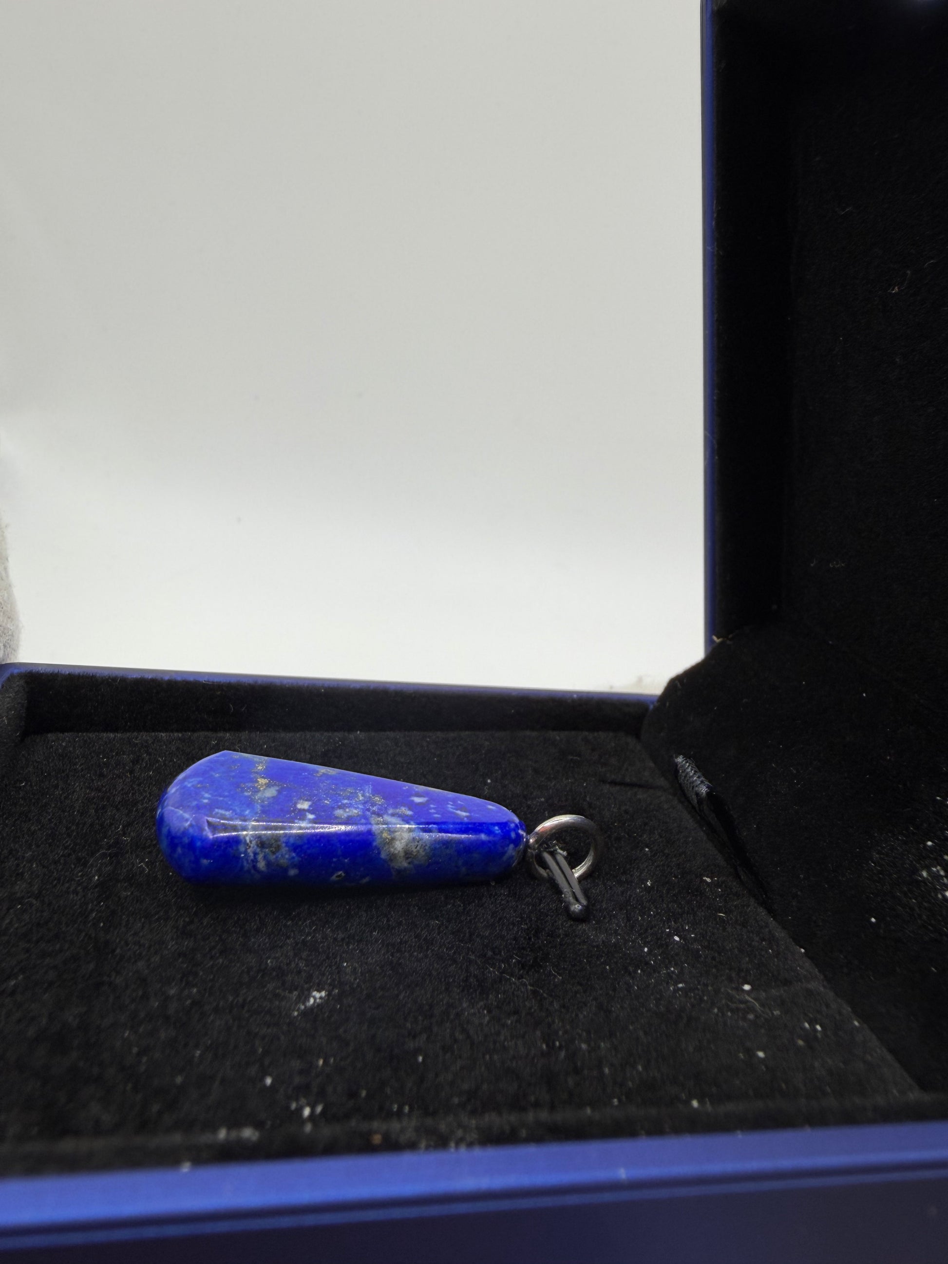 Handcrafted lapis lazuli pendant close-up showing pyrite flecks and rich blue color – Jewelry and Gems by Chandler