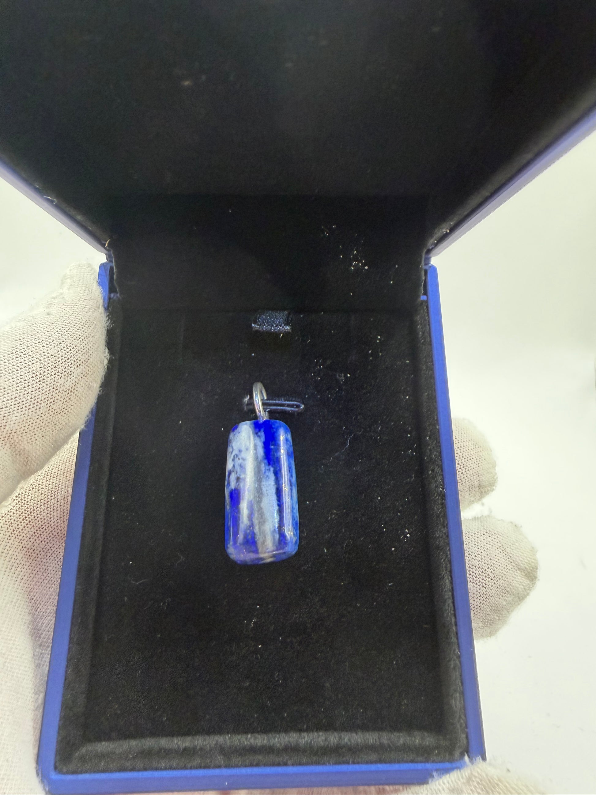 Close-up of 30ct Lapis Lazuli pendant showing rich blue color and natural pyrite flecks — Jewelry and Gems by Chandler