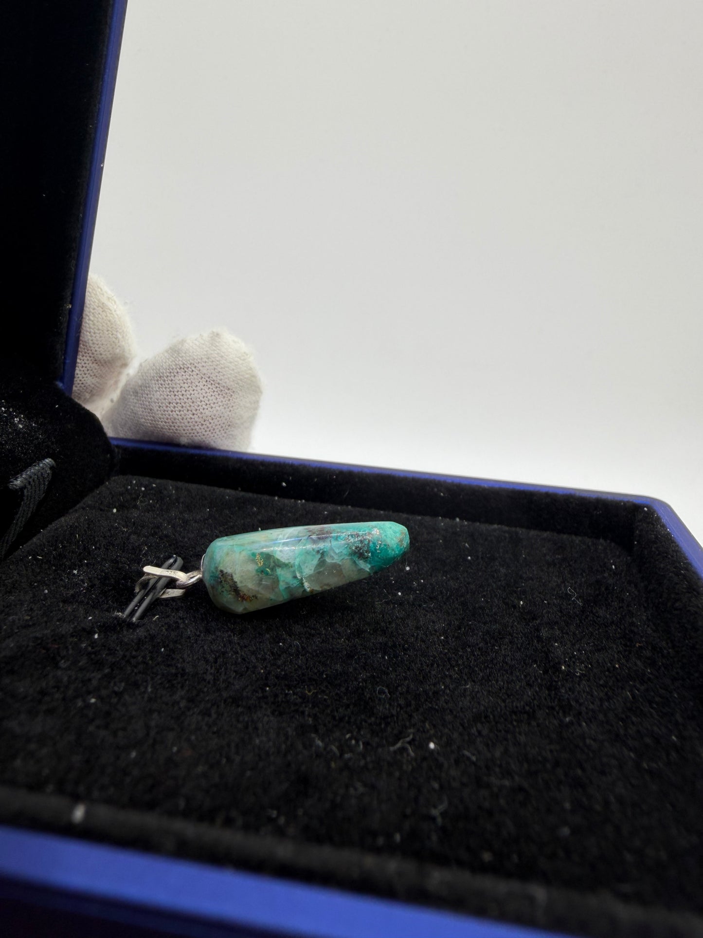 Side view of Namibian Quantum Quattro natural gemstone pendant with sterling silver bail — one-of-a-kind handcrafted jewelry