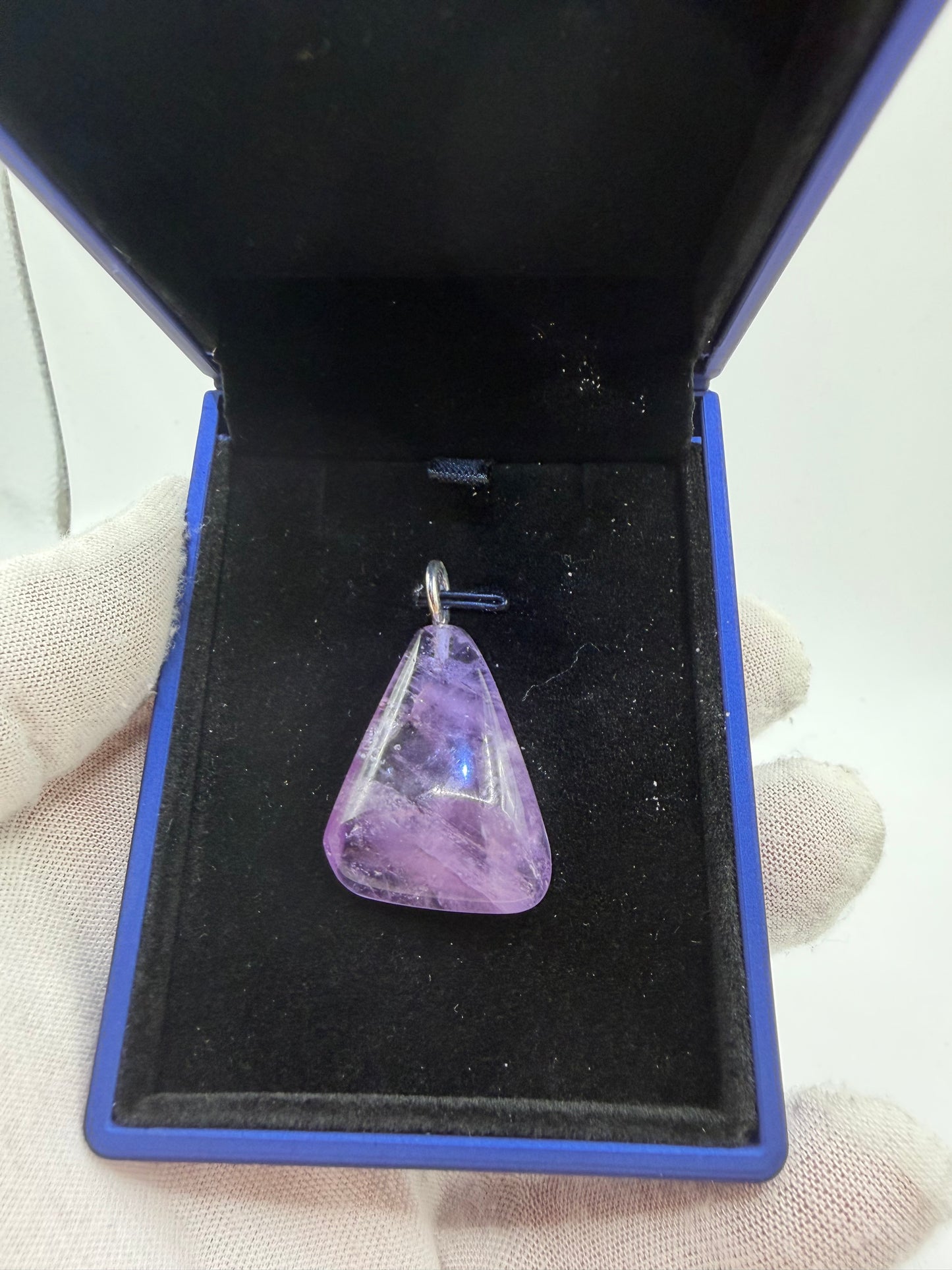 49ct Rwandan amethyst pendant with sterling silver bail displayed in jewelry box