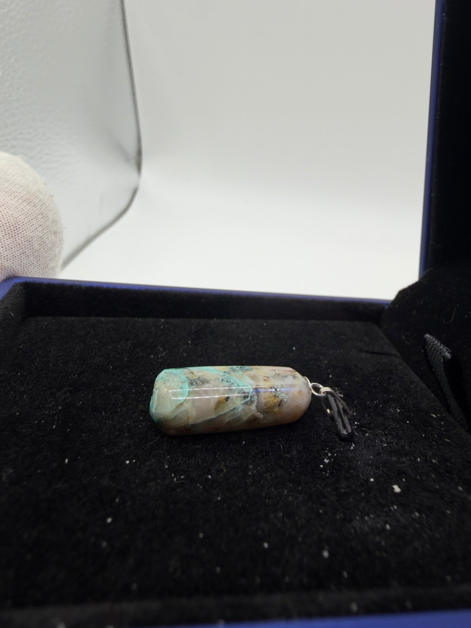 Namibian Quantum Quattro pendant 15ct displayed to show full stone size and drill bail setting, rare gemstone jewelry by Jewelry and Gems by Chandler