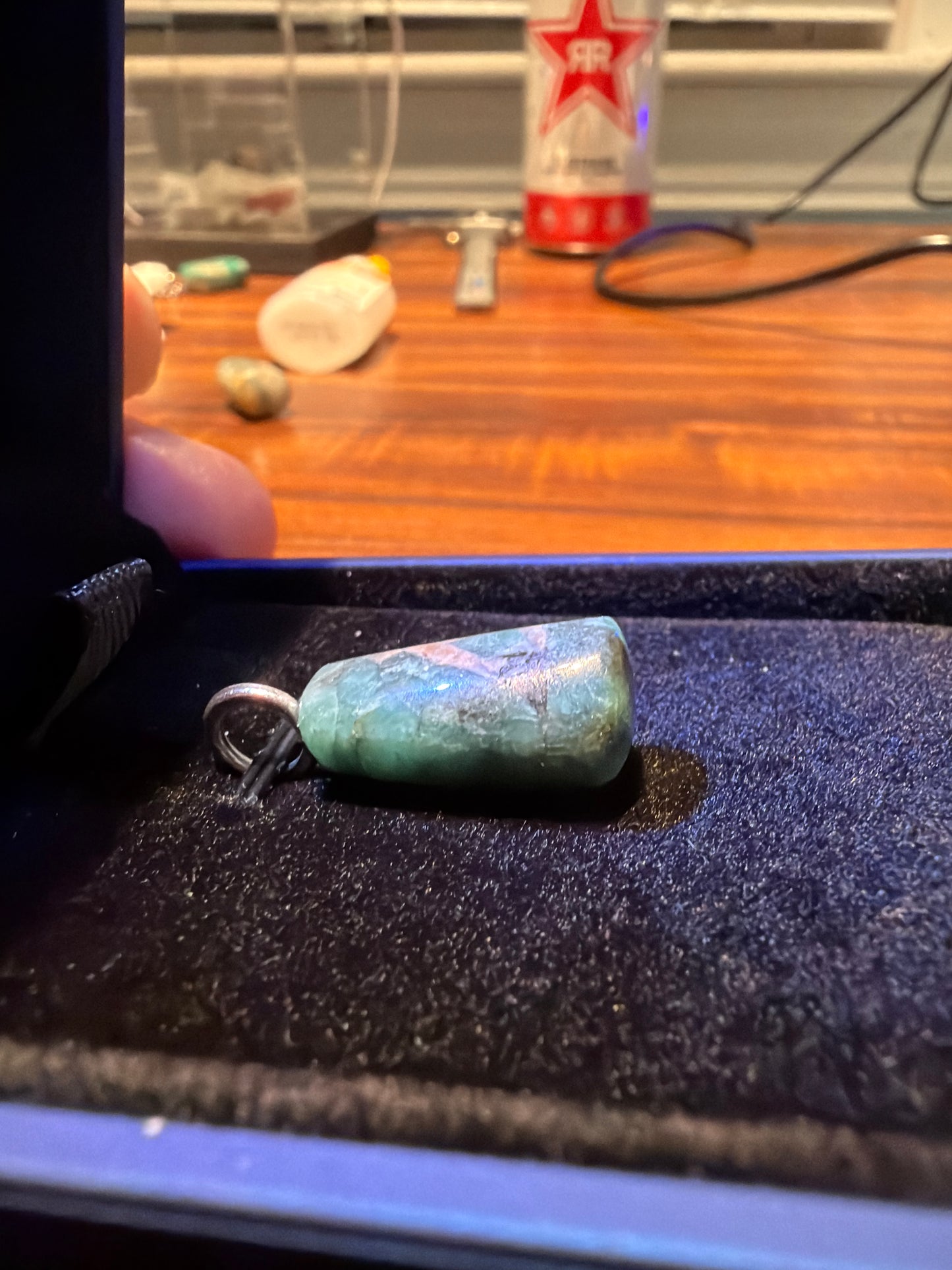 Close-up of 19ct translucent emerald showing bull hoof breakout pattern with natural inclusions