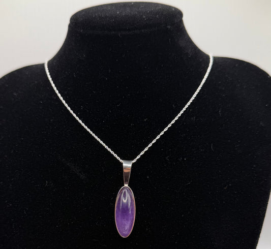Slender oval Rwandan Amethyst pendant handcrafted in Maine sterling silver with 18 inch chain included