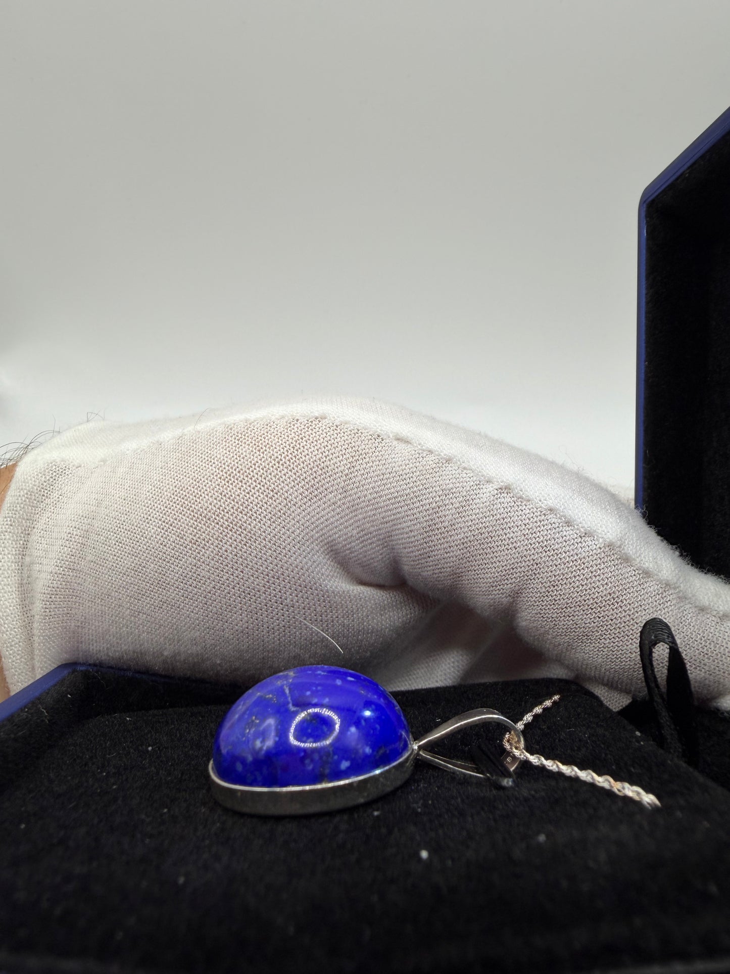 Natural untreated lapis lazuli stone with golden pyrite inclusions set in sterling silver pendant with chain from Maine