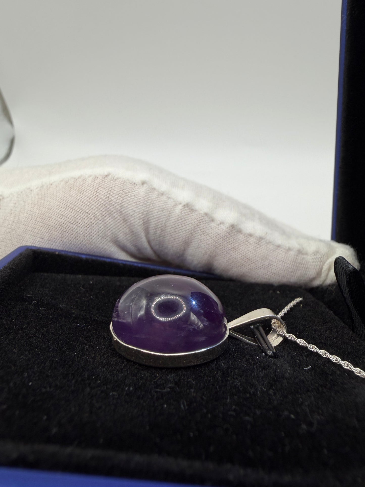 Natural untreated Rwandan amethyst stone set in sterling silver pendant with chain from Maine