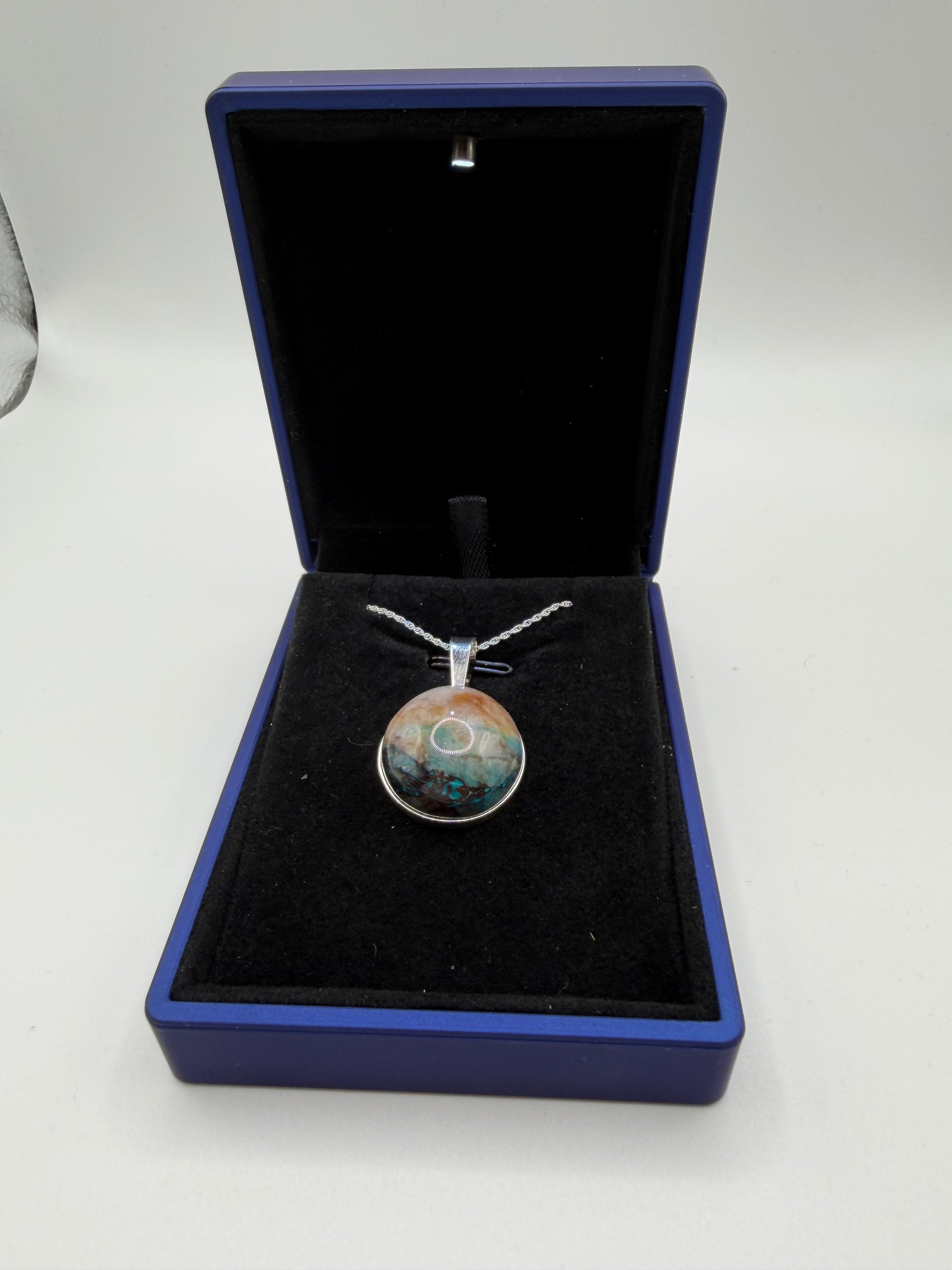 Close-up of Quantum Quattro cabochon from Namibia showing deep blue Shattuckite and green matrix patterns