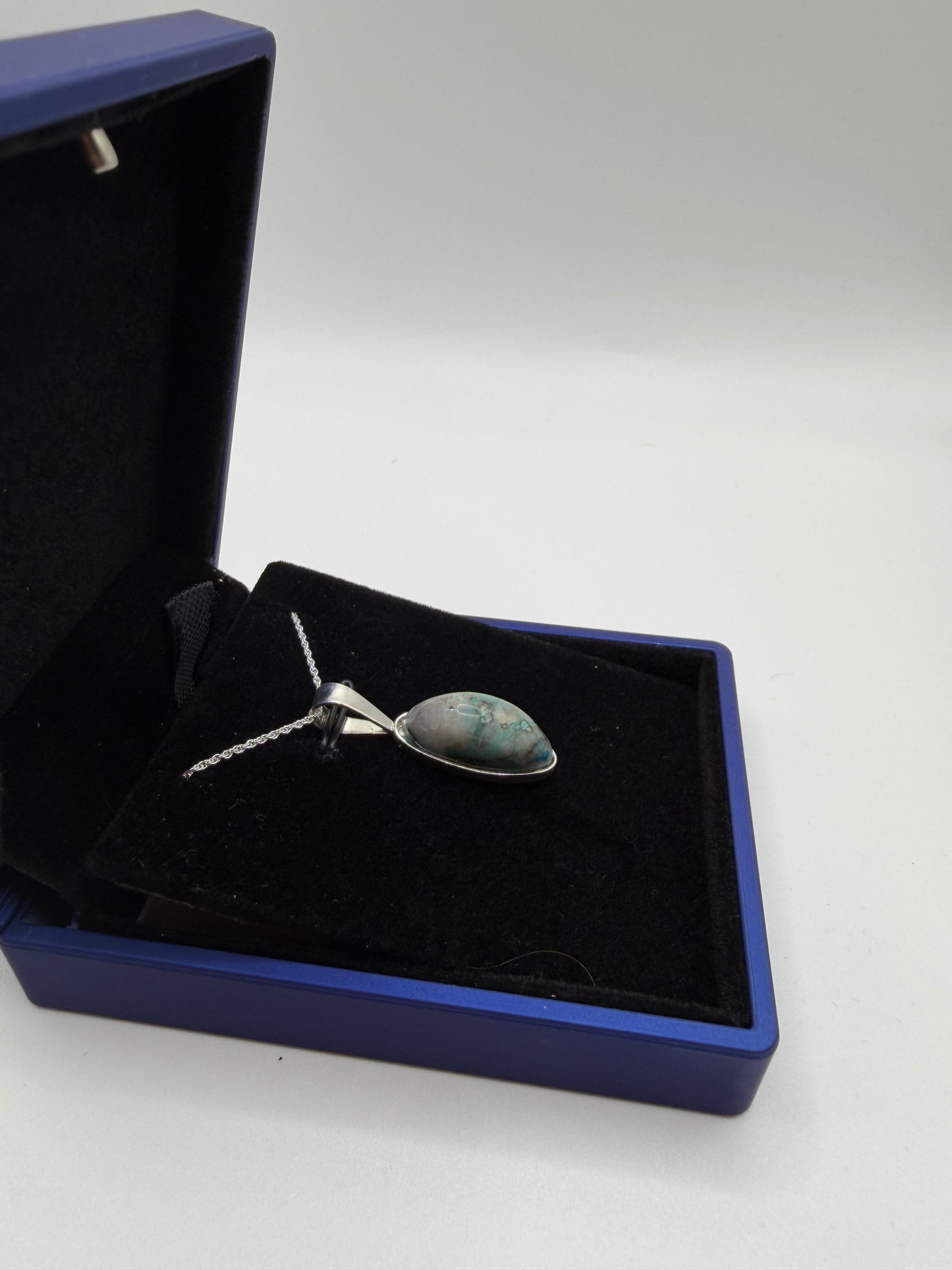 Sterling silver bail and chain on slender oval Quantum Quattro pendant handcrafted in Maine