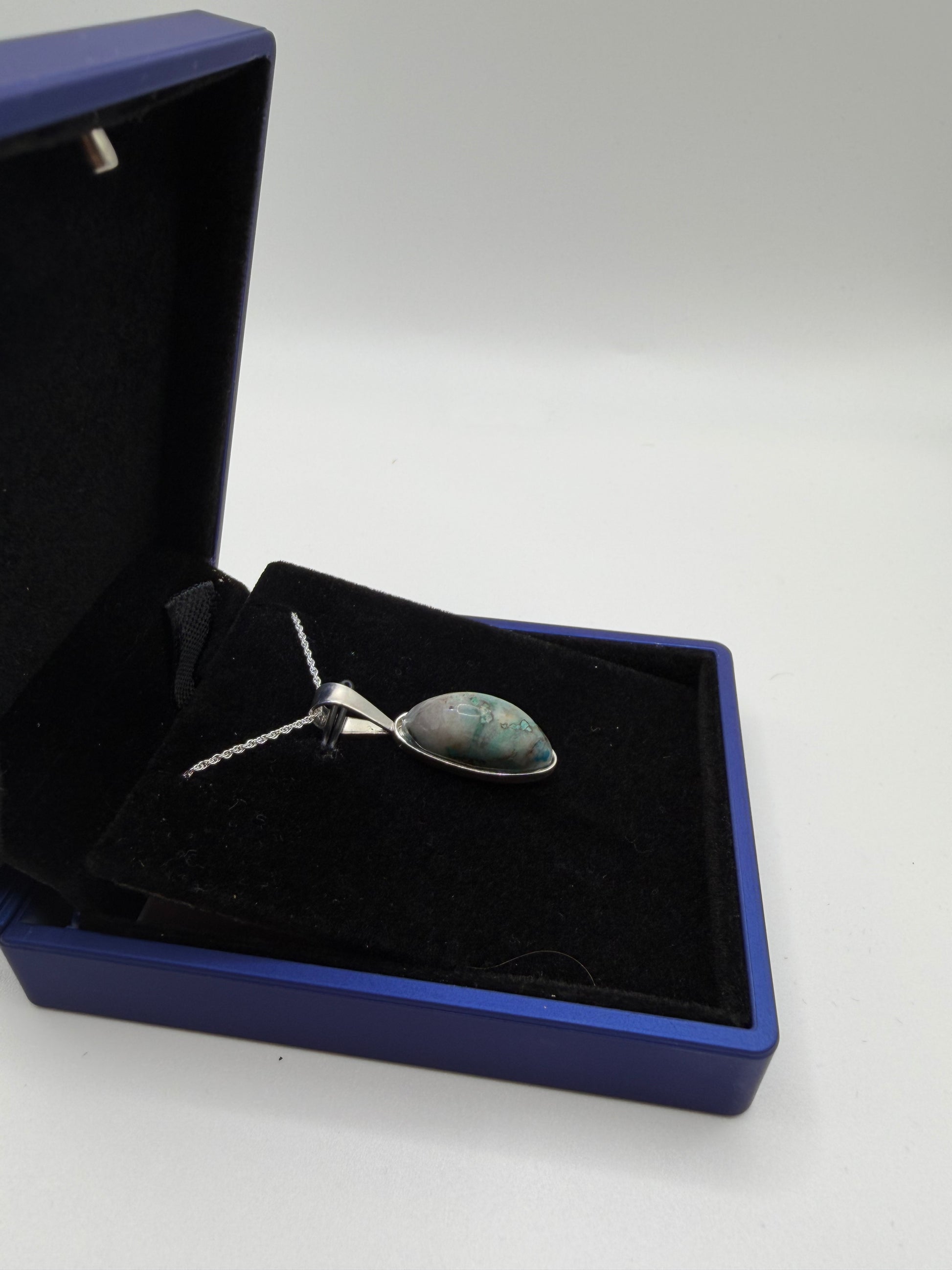 Sterling silver bail and chain on slender oval Quantum Quattro pendant handcrafted in Maine