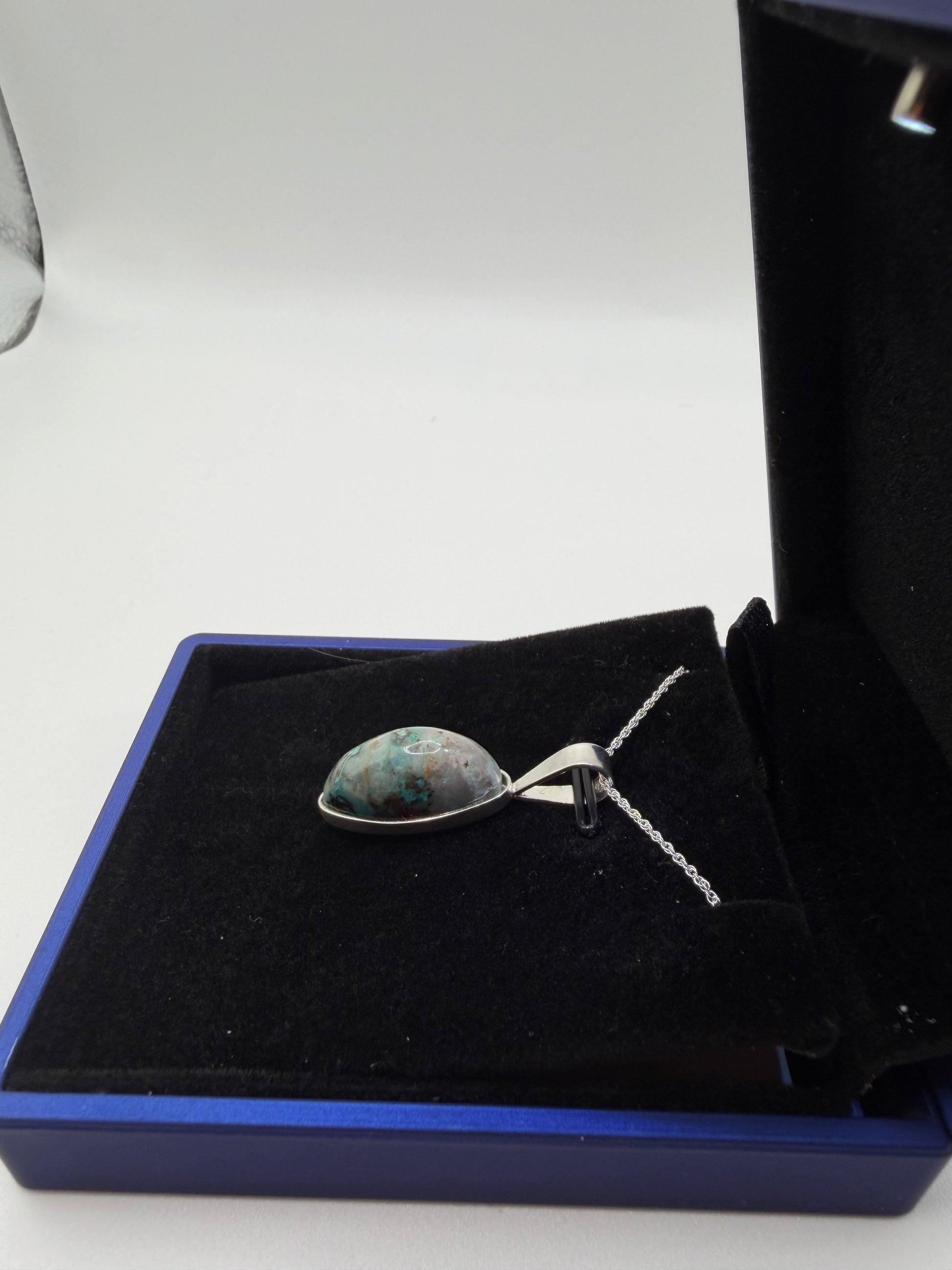 Natural untreated Quantum Quattro mix (Shattuckite, Chrysocolla, Malachite in quartz) in slender oval cabochon