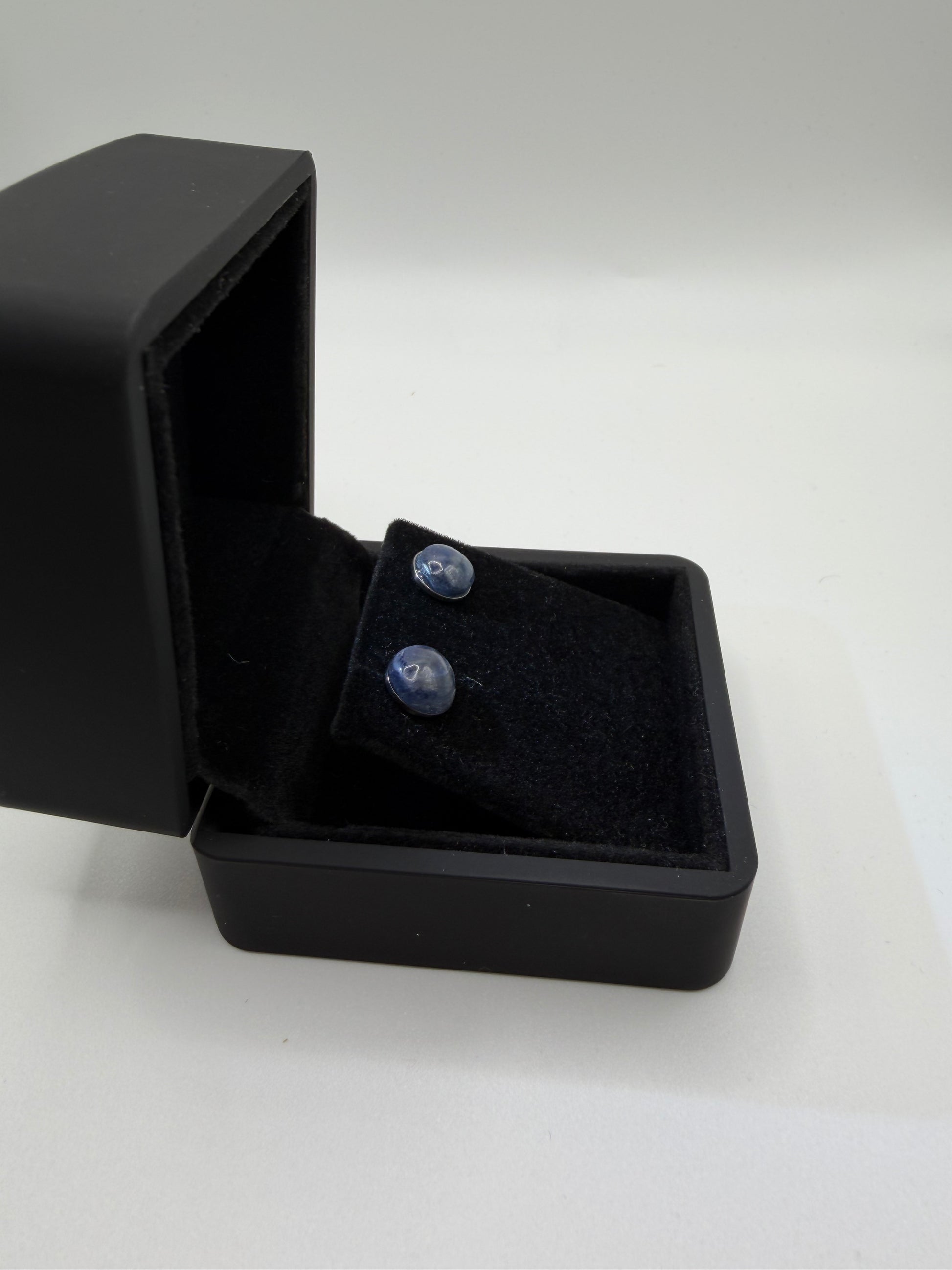 Titanium post and back on 8mm sapphire stud earring handcrafted in Maine