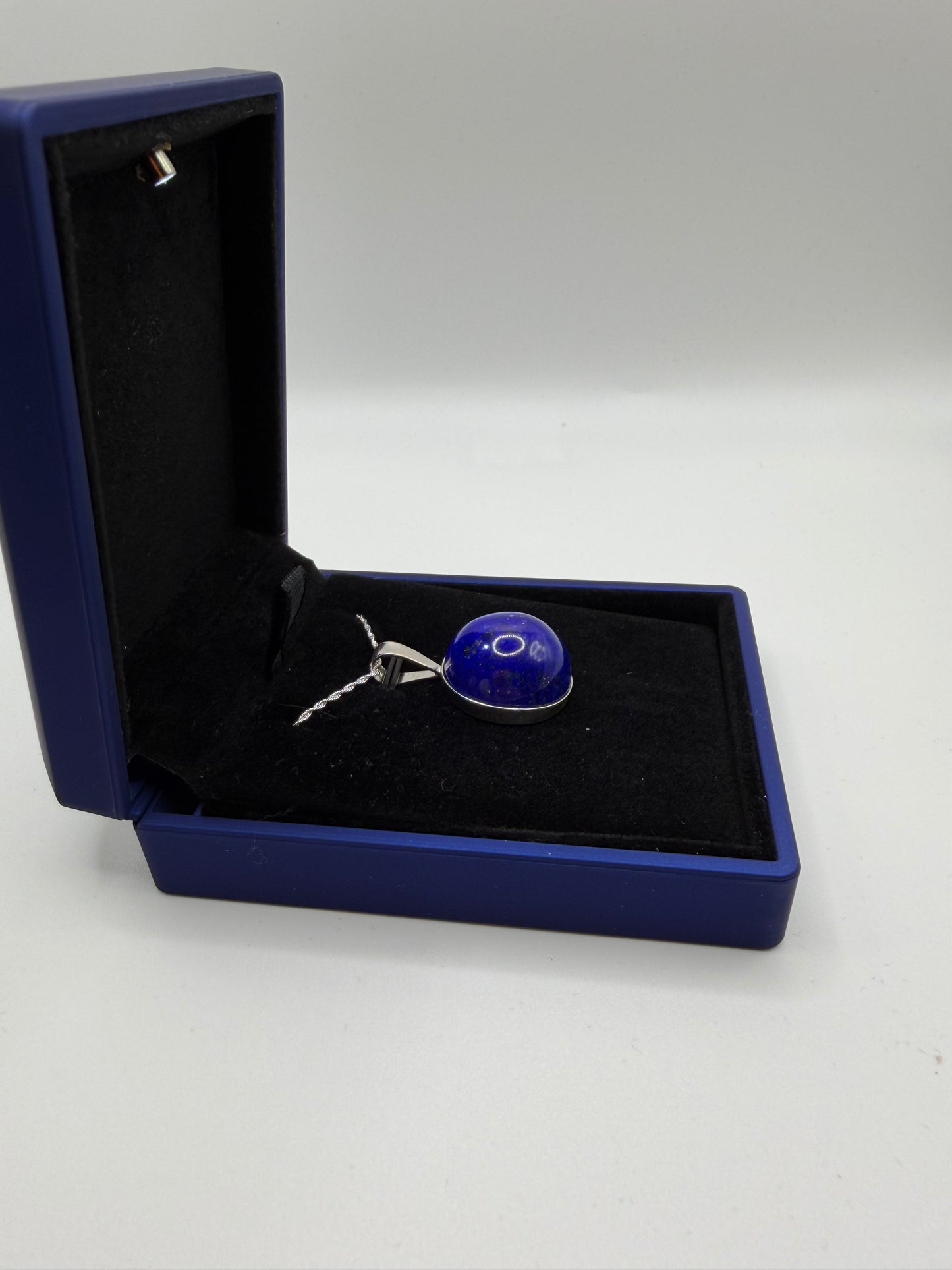 Sterling silver bail and 18 inch 1mm rope chain on 20mm lapis lazuli pendant handcrafted in Maine