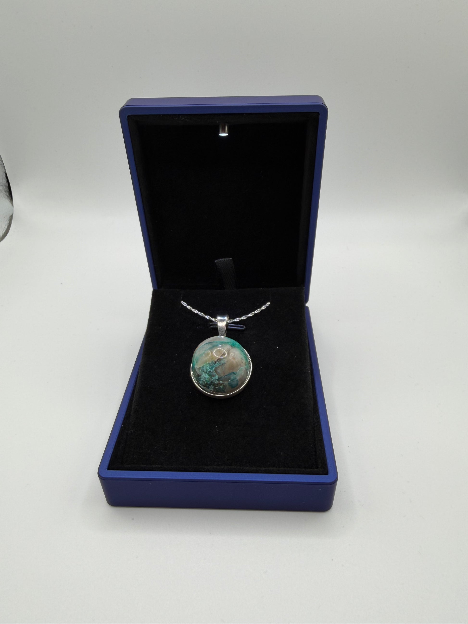 Close-up of Quantum Quattro cabochon from Namibia showing deep blue Shattuckite and green matrix patterns