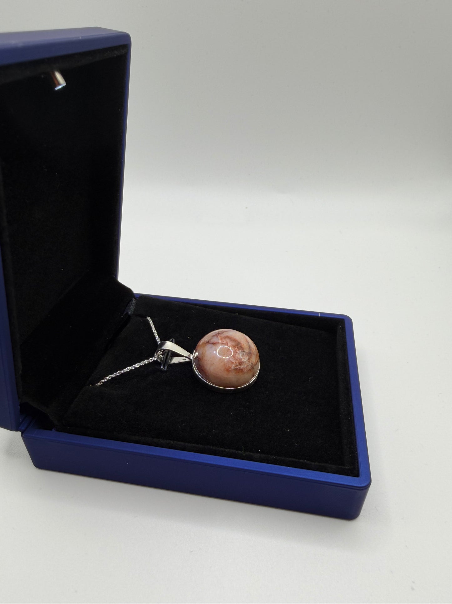 Natural untreated Hartland Carnelian rough stone before setting in sterling silver pendant