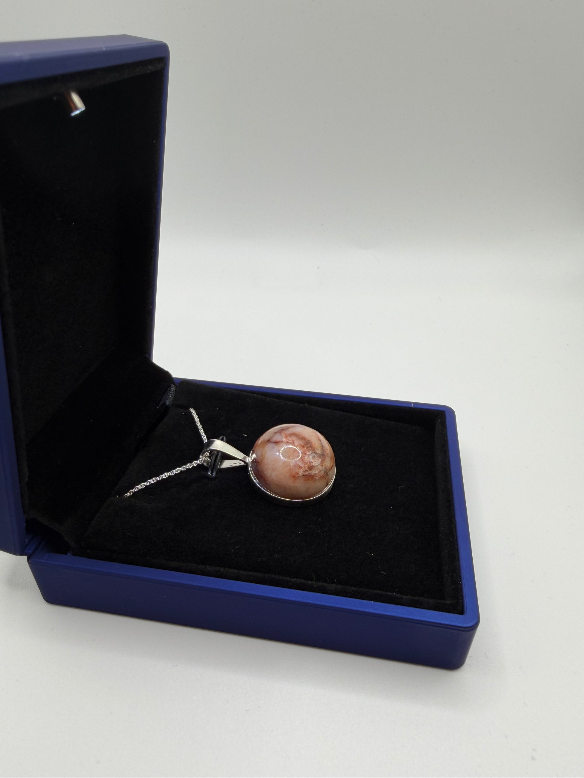 Natural untreated Hartland Carnelian rough stone before setting in sterling silver pendant