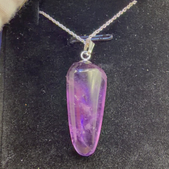 Video of 21ct Rwandan Amethyst pendant rotating to show deep purple color and natural clarity, handcrafted in Maine with chain