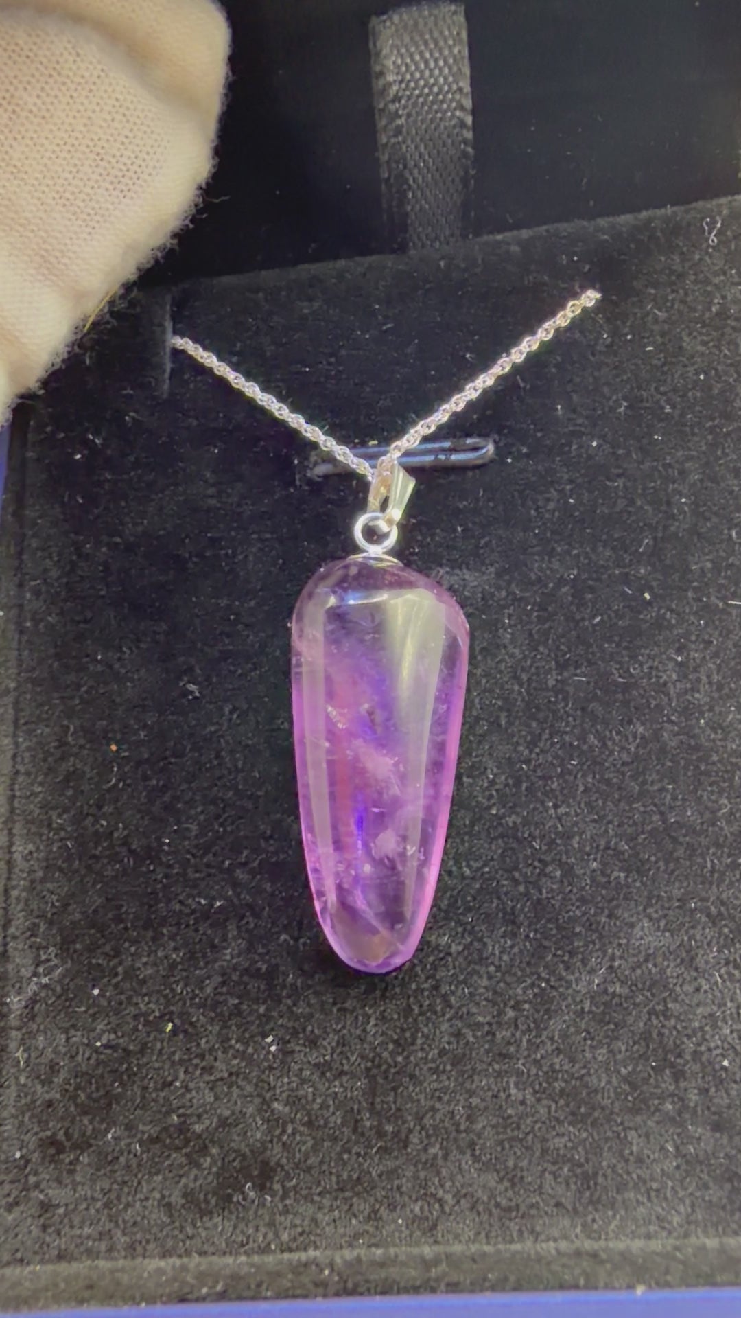 Video of 21ct Rwandan Amethyst pendant rotating to show deep purple color and natural clarity, handcrafted in Maine with chain
