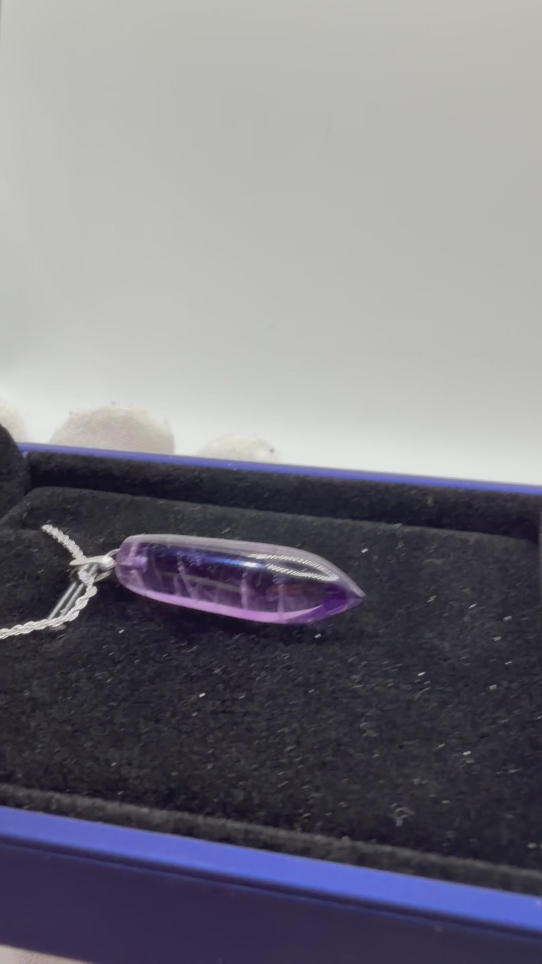 Video of 16ct Rwandan Amethyst pendant rotating to show deep purple color and natural clarity, handcrafted in Maine with chain